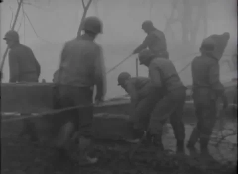 GERMANY - 1945: Bridge construction - Work party sets planks into bridge deck 動画素材 344493519