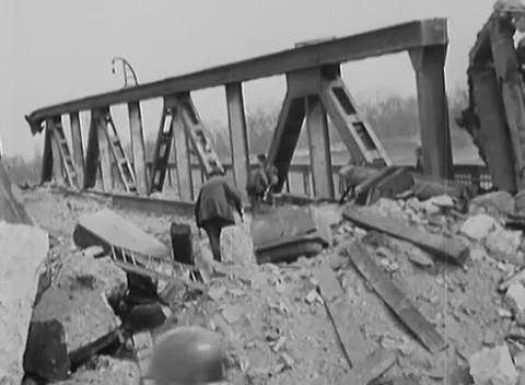 GERMANY - 1945: Bridge destruction - Truss span lies across shattered masonry Stock Footage 344509659