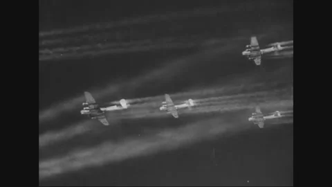 GERMANY - 1945: Eighth Air Force bombers stream vapor trails at dawn Stock Footage 340210088