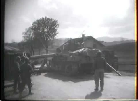 GERMANY - 1945: Field observation - Smoke rises beyond damaged farm buildings Stock Footage 344486903