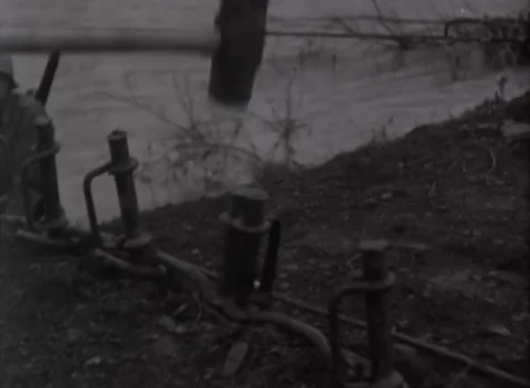GERMANY - 1945: German footbridge construction - Soldiers anchor footbridge Stock Footage 344492823
