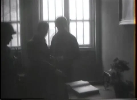 GERMANY - 1945: Interior documentation - Soldiers inspect prison room and ledger Stock Footage 344486913
