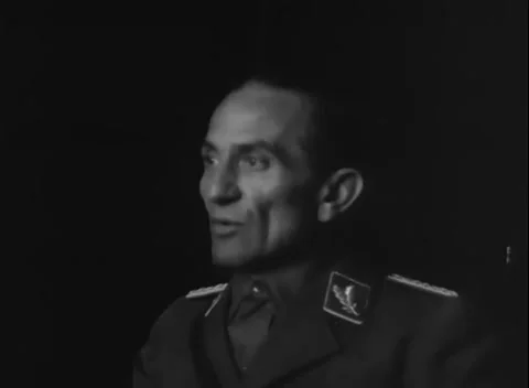 GERMANY - 1945: Leaf-pattern collar patch - An officer sits at a cluttered table Stock-Footage 344598846