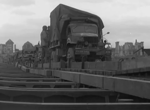 GERMANY - 1945: Loaded cab lineup - A canvas truck heads a queued column Stock Footage 344598295