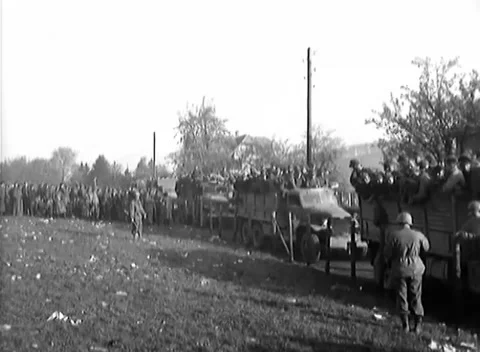 GERMANY - 1945: Loading - Truck Column Loads Prisoners by the Village Road Video stock 344493601