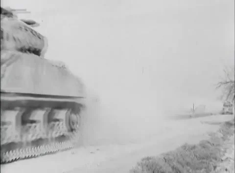GERMANY - 1945: Low hedge and tree - Dust whiteout hides a vehicle Stock Footage 344598371
