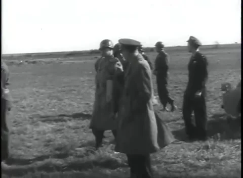 GERMANY - 1945: Pale marking on helmet - Officers stand beneath a wing Stock Footage 344598422