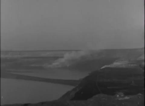 GERMANY - 1945: River assault position - Smoke screen covers flooded river plain Stock Footage 344493574