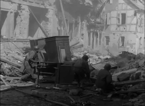 GERMANY - 1945: Rubble ascent - Infantry climb into gutted building Stock Footage 344488695