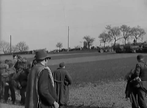 GERMANY - 1945: Ruhr Pocket surrender - Mass prisoner assembly covers farmland Stock Footage 344493653