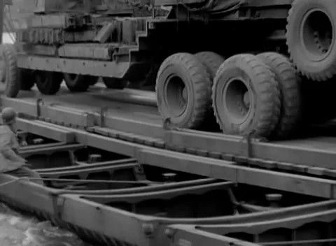 GERMANY - 1945: Saddle beam close-up - Truck wheels rest on a steel treadway Stock Footage 344598296