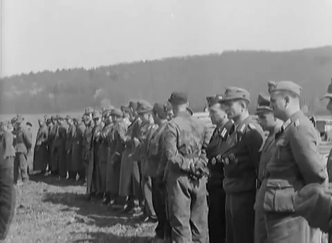 GERMANY - 1945: Surrender line - Long Officer Line Stretches Across the Field Stock Footage 344493630
