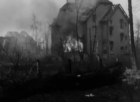 GERMANY - 1945: Urban fire damage - Flames engulf damaged brick building Stock Footage 344486921