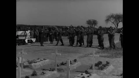 GERMANY - 1945 - US honor guard fires salute at a POW cemetery in Gardelegen, Stock Footage 296694420