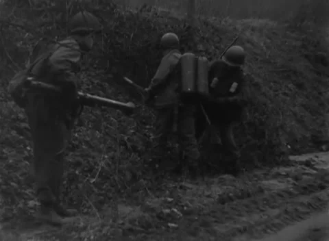 GERMANY - 1945: Weapons demonstration - 94th flamethrower team enters drill Stock Footage 344492702
