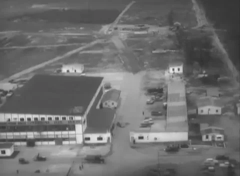 GERMANY - 1948: Air base facilities - Buildings cluster beside tracks and roads Stock Footage 344496171