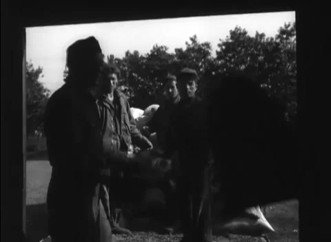 GERMANY - 1948: Manual freight loading - Truck crew builds a wall of supply bags Stock Footage 344496230