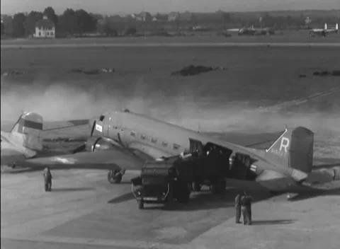 GERMANY - 1948: Powered flight line - Engine blast sweeps dust past waiting crew Stock Footage 344496242