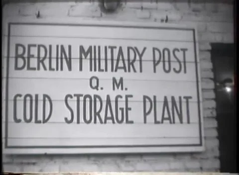 GERMANY - 1949: Cold storage - Berlin post sign and soldier by truck convoy Stock Footage 344495603