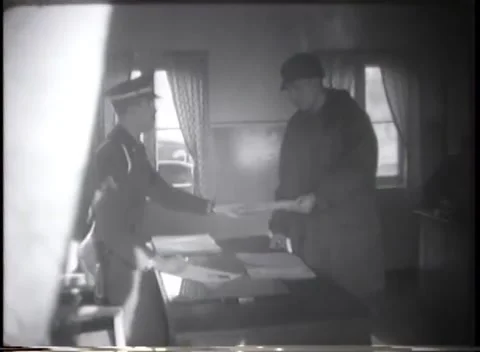 GERMANY - 1949: Document check - Uniformed men inspect documents at office desk Stock Footage 344495581