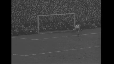 GERMANY 1950s: A soccer match is in progress. Players wearing white and dark Stock Footage 279246548