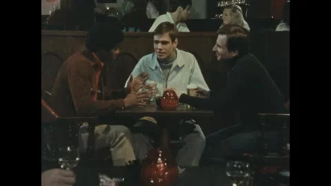 GERMANY - 1976 - In this US Army Training film, the spy clinks his beer glass Stock Footage 340576743