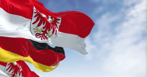 Germany and Brandenburg state flags waving in the wind Stock Footage 316831027