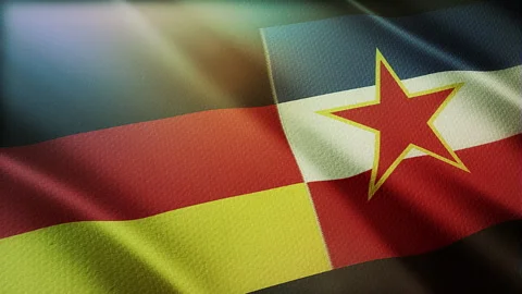 Germany and Yugoslavia flags are waving in the wind. 스톡 동영상 315624077