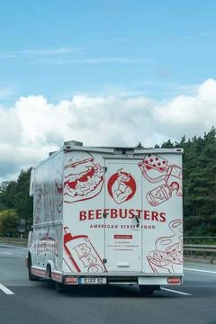 Germany - Aug 22, 2026: Vertical frame of a Beefbusters delivery truck with red Stock Photos