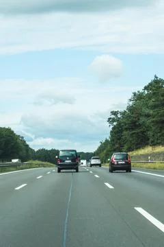 Germany - Aug 22, 2026: Vertical view of dark cars driving ahead on a motorway Stock Photos