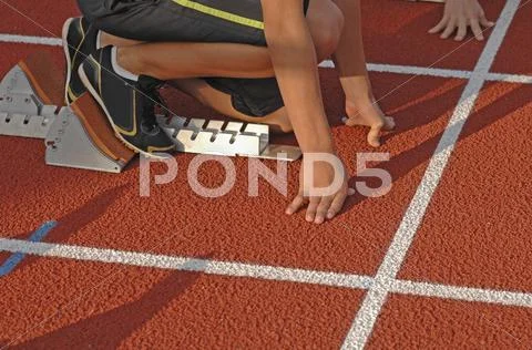 Germany, Baden-Wurttemberg, Mossingen, Runners ready at starting line Stock Photos