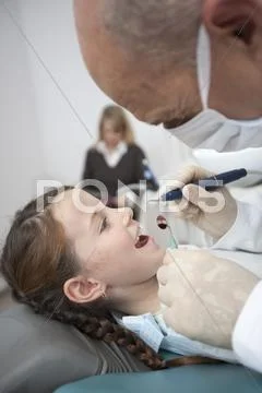 Germany, Bavaria, Landsberg, Girl (8-9) In Dentists Chair