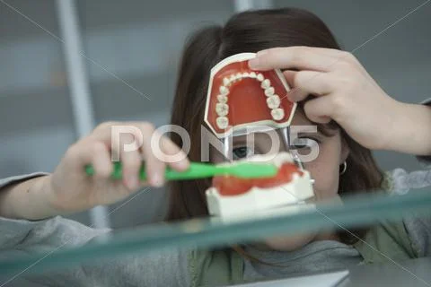 Germany, Bavaria, Landsberg, Girl (8-9) in dental surgery Stock Photos