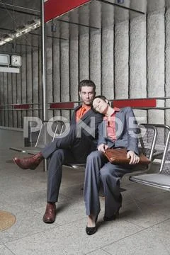 Germany, Bavaria, Munich, Business people at underground station platform Stock Photos