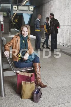 Germany, Bavaria, Munich, Four Persons on subway platform Stock Photos