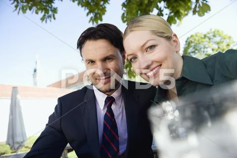 Germany, Bavaria, Upper Bavaria, Businessman and Businesswoman in beer garden, Stock Photos