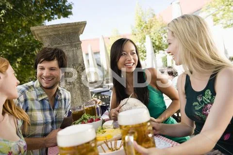 Germany, Bavaria, Upper Bavaria, Young people in beergarden Stock Photos