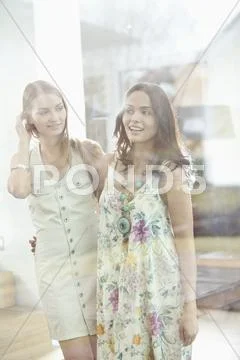 Germany, Bavaria, Young women looking away, smiling Stock Photos