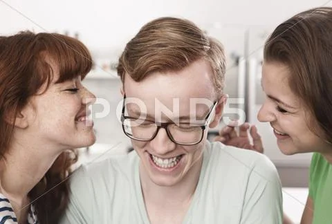 Germany, Berlin, Close up of young man and women beside him, smiling Stock Photos