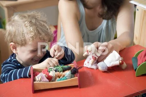 Germany, Berlin, Mother playing with son (3-4) Stock Photos