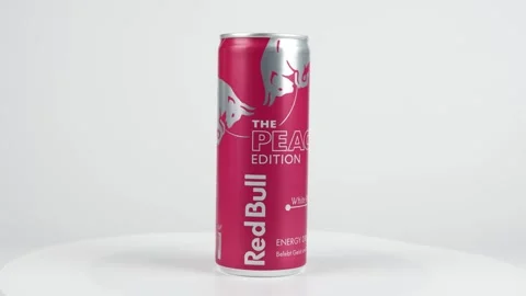 Germany Berlin October 10, 2025. The Red Bull Peach Edition can slowly rotates Stock Footage 318797947