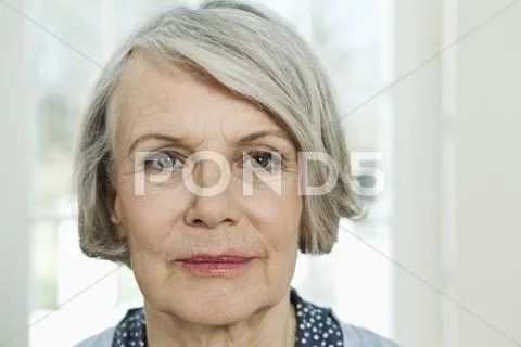 Germany, Berlin, Senior woman smiling, portrait Stock Photos