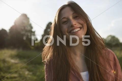 Germany, Berlin, Teenage girl smiling, portrait Stock Photos