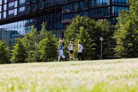 Germany, Berlin, Three persons jogging Stock Photos