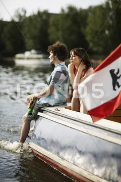 Germany, Berlin, Young Couple On Motor Boat