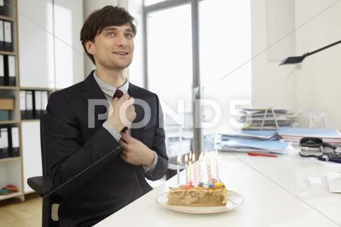 Germany, Cologne, Mid Adult Man With Birthday Cake, Smiling
