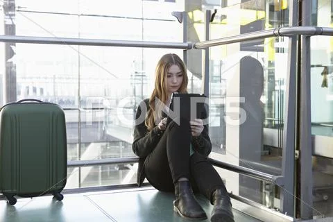 Germany, Cologne, Teenage Girl Using Digital Tablet
