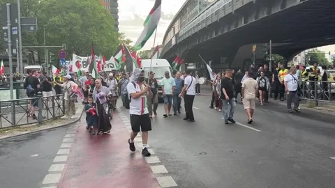 Germany: Demonstrators march in Berlin to protest Israeli attacks on Gaza... Stock Footage 337323992