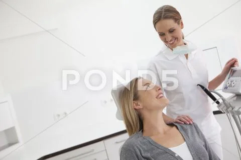Germany, Dentist And Patient In Clinic, Smiling