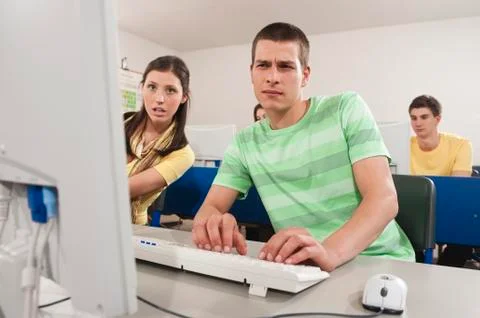 Germany, Emmering, Students using computer in computer lab Stock Photos